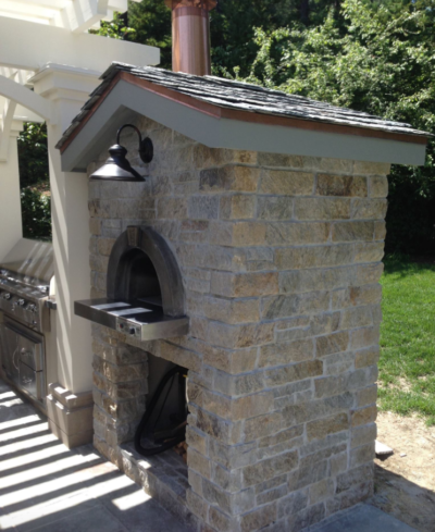 Luxury outdoor living space with the HPC Fire Forno de Pizza Di Napoli Series masonry-style pizza oven