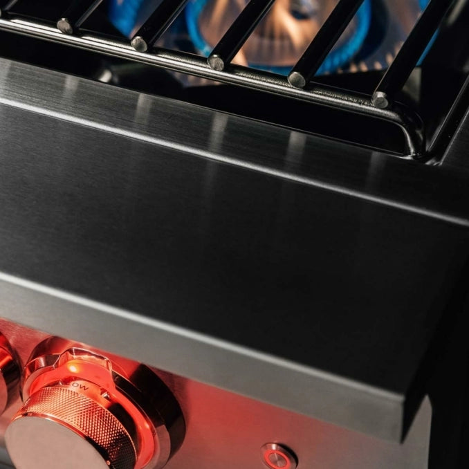 Angled view of the TrueFlame 304 stainless steel power burner with LED lighting