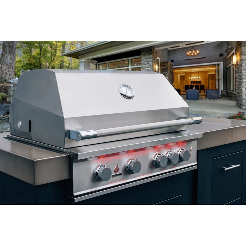 Luxury outdoor kitchen featuring a TrueFlame built-in stainless steel gas grill