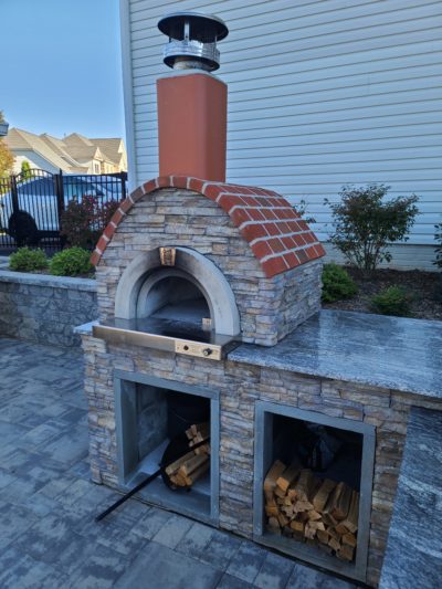 HPC Fire Forno de Pizza Di Napoli Series built-in pizza oven installed in a luxury outdoor kitchen