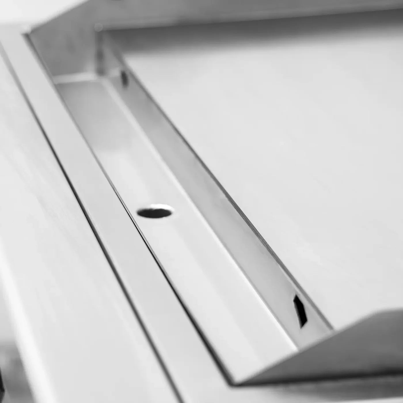 Open-lid outdoor flat top griddle showing full cooking surface