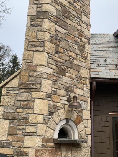 Premium backyard installation of the HPC Fire Forno de Pizza Di Napoli Series hybrid gas and wood pizza oven